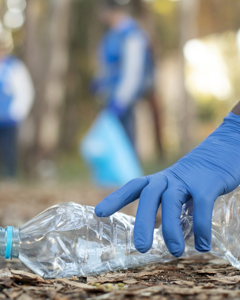 close-up-hand-holding-plastic-bottle